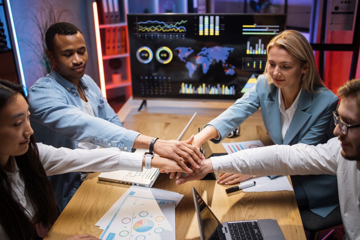 diverse-office-colleagues-stacking-their-hands-aft-2024-12-13-05-39-23-utc